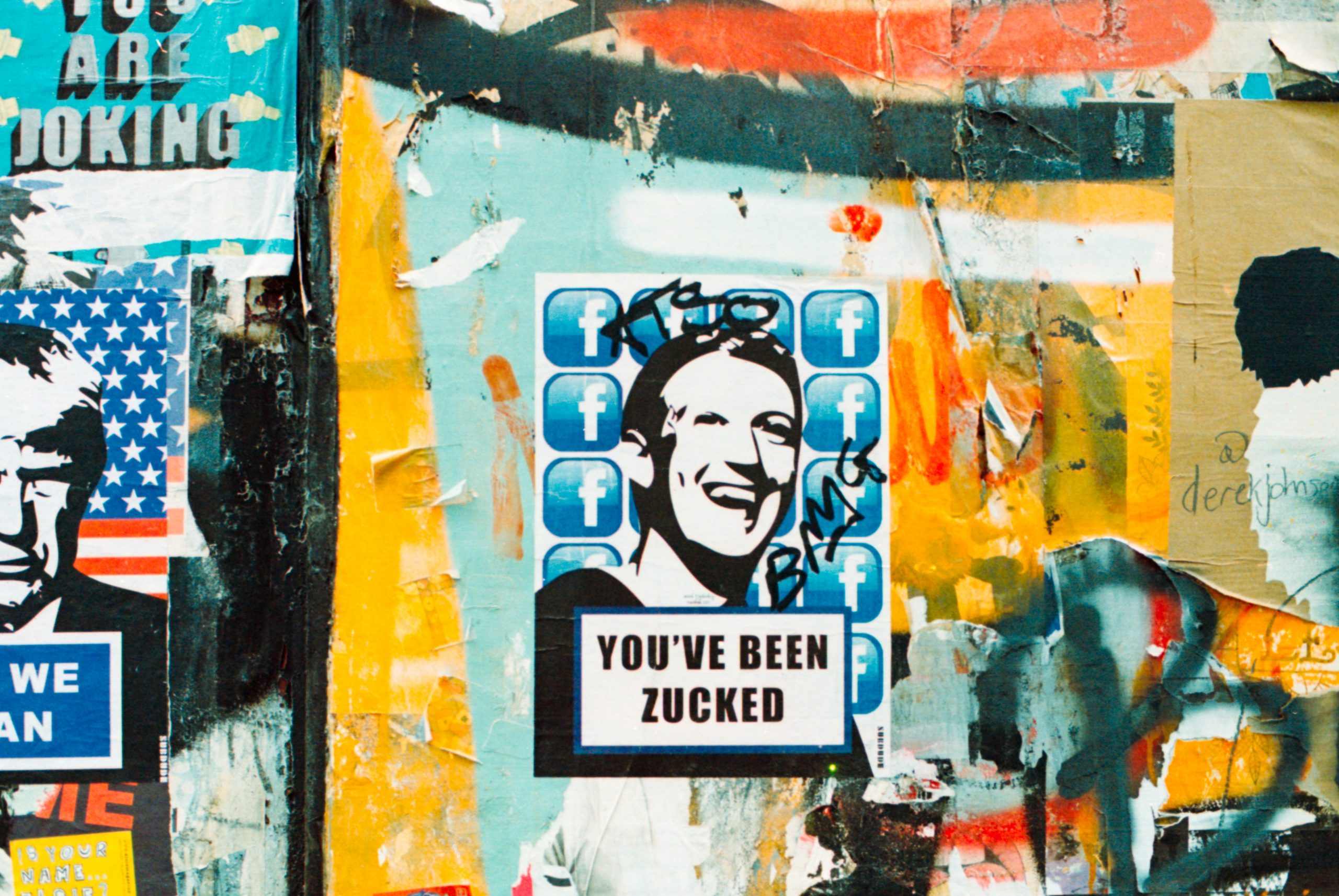 Streetart with facebook symbols and Zuckerberg's face and caption that says "You've been zucked"
